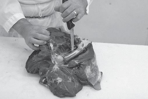 Figure 9. Removing loin. Figure 7. Boning out hind leg.