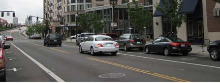 Angled parking can accommodate a large number of parking stalls, however parallel parking minimizes the impact