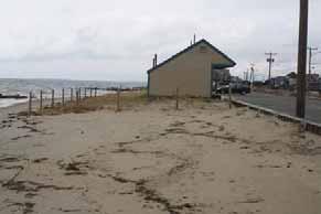 Beach include the asphalt parking area, restroom facility, and a retaining wall between the parking lot and sidewalk to contain a septic