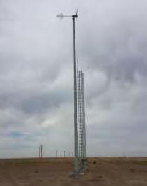 Figure 1. T701 Turbine installed at High Plains Regional Test Center; view west from data shed, met tower behind turbine.