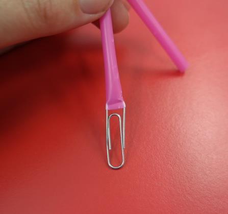 Step one: Insert the thicker part of the paperclip into