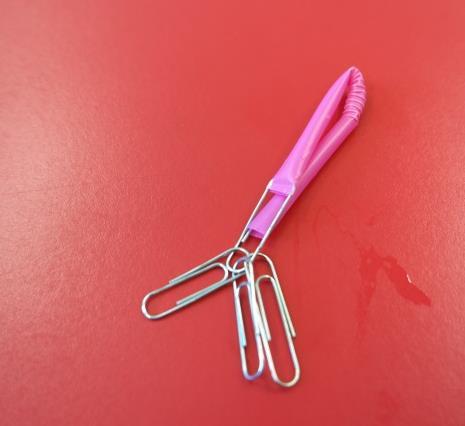 top. Keep adding one paper clip at a time until it is