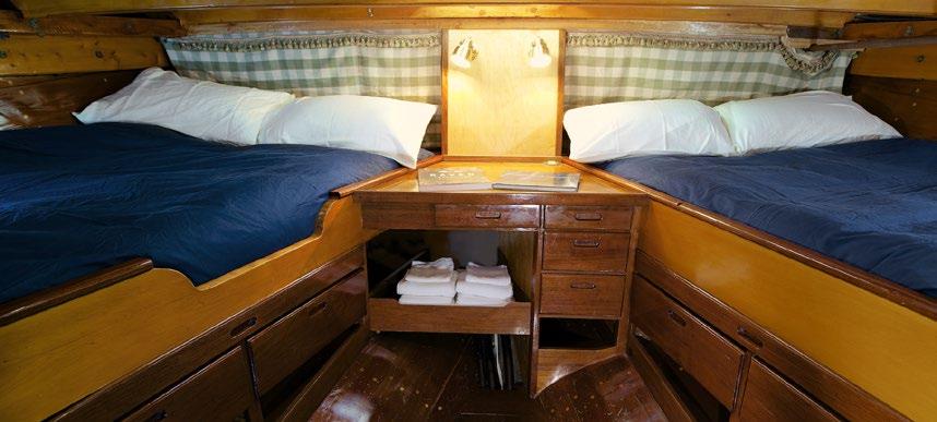 The aft stateroom is accessed from the wheelhouse, and boasts a large skylight, two double