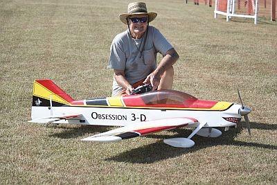 4 Above is the big OBSESSION 3D ARF that Bud Austin put together and flew before making some sort of swap with Jim Haney. Jim looks happy he acquired the plane or maybe happy it is still in one piece.