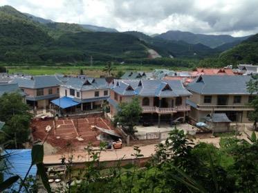The villagers used the government s compensation to build themselves rich new mansions.