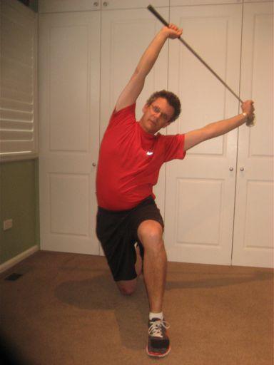 The golfer leans toward the front leg to increase the stretch. The golfer should hold this position for 45 seconds Shoulder Blade Activation The golfer holds a length of theraband overhead.