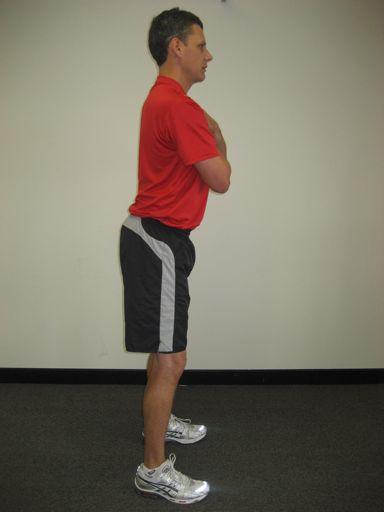 Step 1 - The golfer stands erect and tilts their pelvis under as far as possible, then back as far as