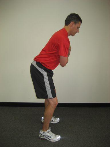 Maintaining this same position of the spine and pelvis, the golfer bends forward at the hips and unlocks