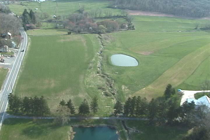 Photo #8 is an aerial view looking at the second, smaller pond on Tract #11.