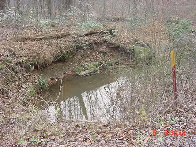 Photo #62 shows bank erosion at the discharge end of the culvert A