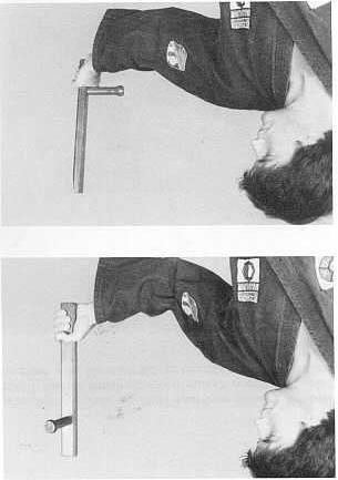 Position 2: Hold the tonfa by its end. In this position the tonfa is used as a club or hammer.