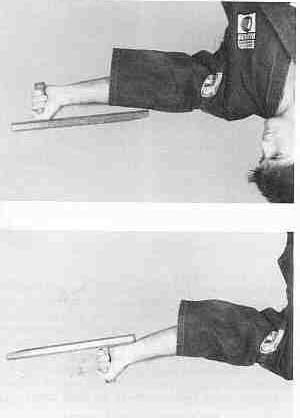 Position 4: Hold the tonfa by its handle with the end forward.