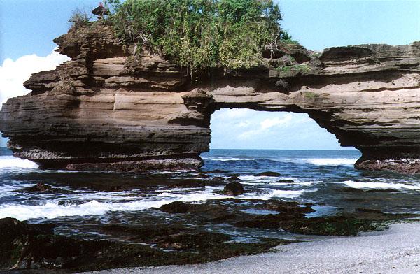 The arch collapses from the erosion, leaving behind the seaward pillar of the rock, known as the stack.