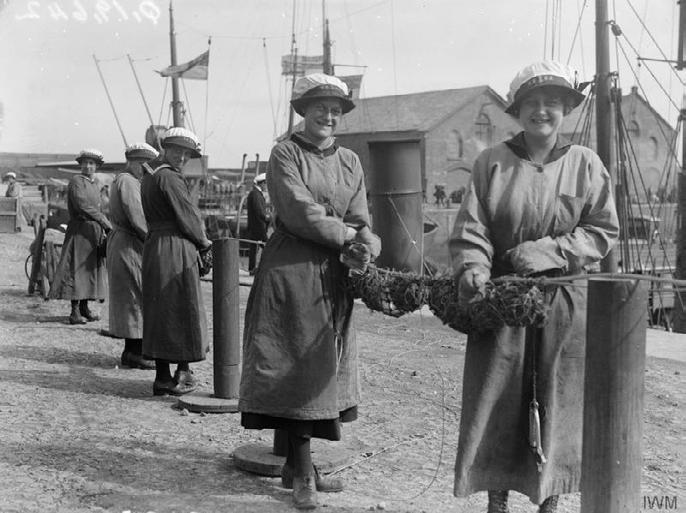 Women of the Women s Royal Naval Service wiring glass floats to anti-submarine nets at Lowestoft in 1918.