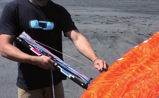 packing Land and safely secure the upwind tip with the supplied sand bag, sand, snow or your