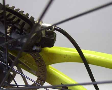 Use the position closest to the drive side for the front derailleur housing. Next, route the housing under the bottom bracket and into the two position stop under the chainstay yoke.