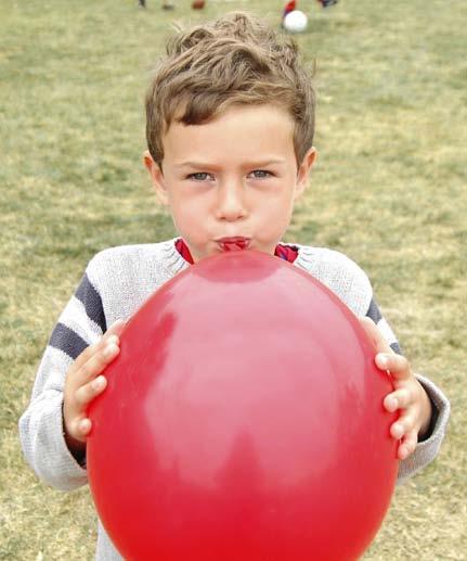 When you fill a balloon with air, the air pushes against the inside of the balloon and makes it harder.