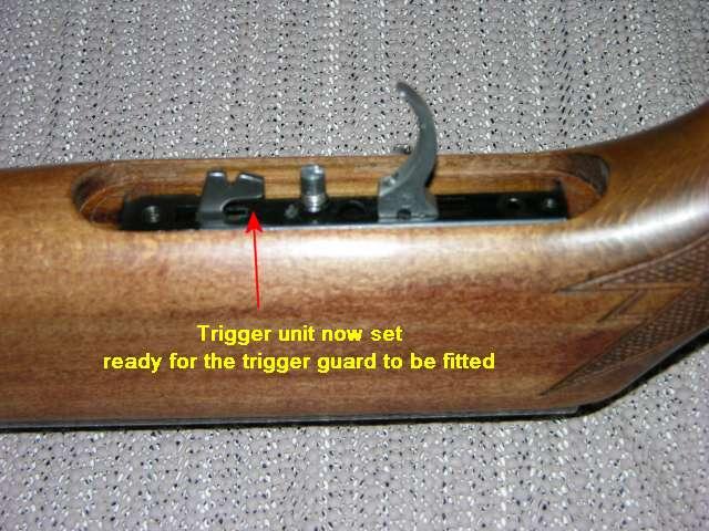 Once you have set the trigger unit you can now refit the trigger guard by holding down