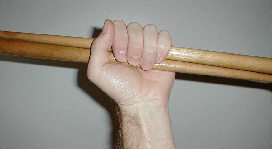 Exercise No. 3 Hold the sticks together with both hands extended, palms facing up - (Fig. 3). Slowly turn the wrists in and under, one following the other. Raise arms over the head.