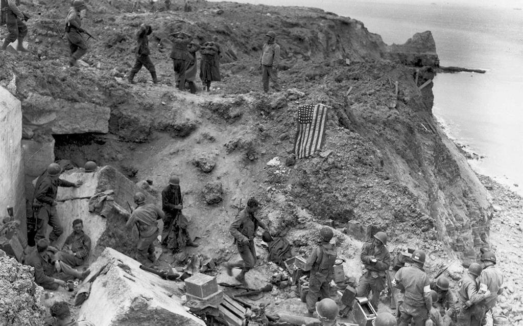 June 8, 1944: A US flag lies as a marker on a destroyed bunker two days after
