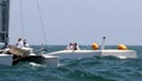 The wind blew up to 22 knots as 160 boats thrashed through waves of 3 to 5 feet. One was dismasted, another beached. Two catamarans flipped upside down.