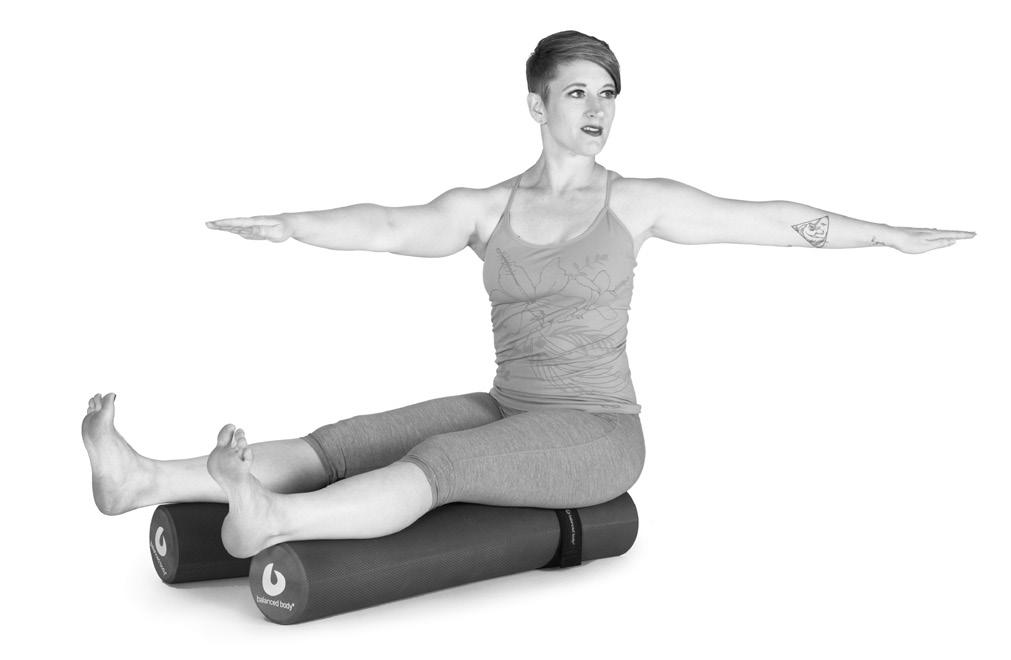 Exhale: Flex your spine forward and reach your forward hand to the leg you are rotated toward.
