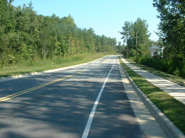 Before Prior to late 2012, Weaver Dairy Road Extension near Homestead Road had a bike lane on the northbound side of the road only; there was no southbound bike lane.