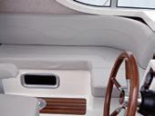 The helm is equipped with full engine instrumentation and an electric switch panel with circuit breakers.