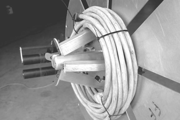 The wheel has eight open tie slots cut into the face of the wheel to conveniently access the wound up hose