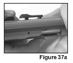 3) Identify the two takedown marks behind the safety lever on the left side