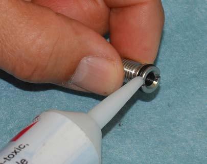 Insert the Orifice Assembly (sharp end first) through the threaded