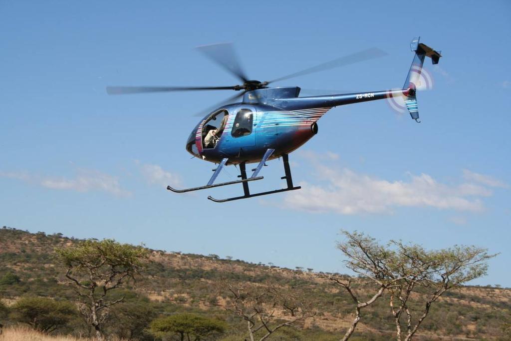 Figure 1: Hughes D500 helicopter in search of white rhinos during the earnotching project at Weenen Game Reserve (South Africa) in 20