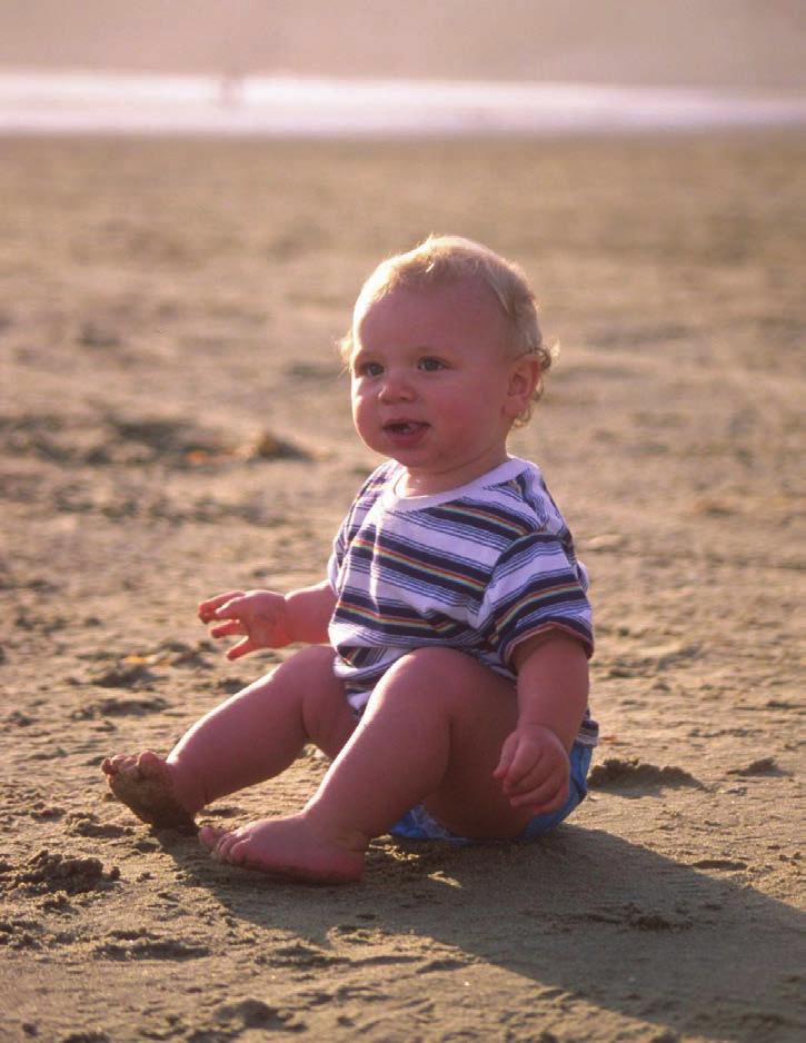 Dan sat on the sand. It was too hot. 2003 by Sarah Gilbert.