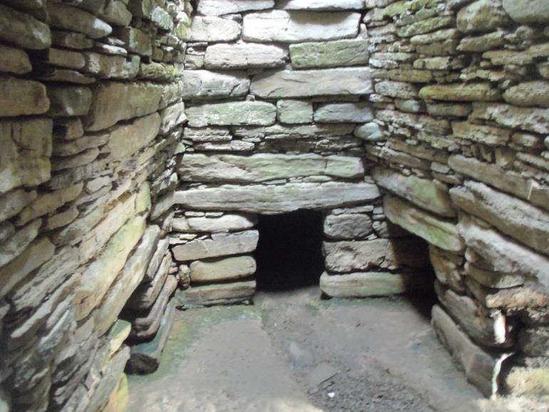 As these next photos show, at the center of the cairn is a dry stone chamber 12