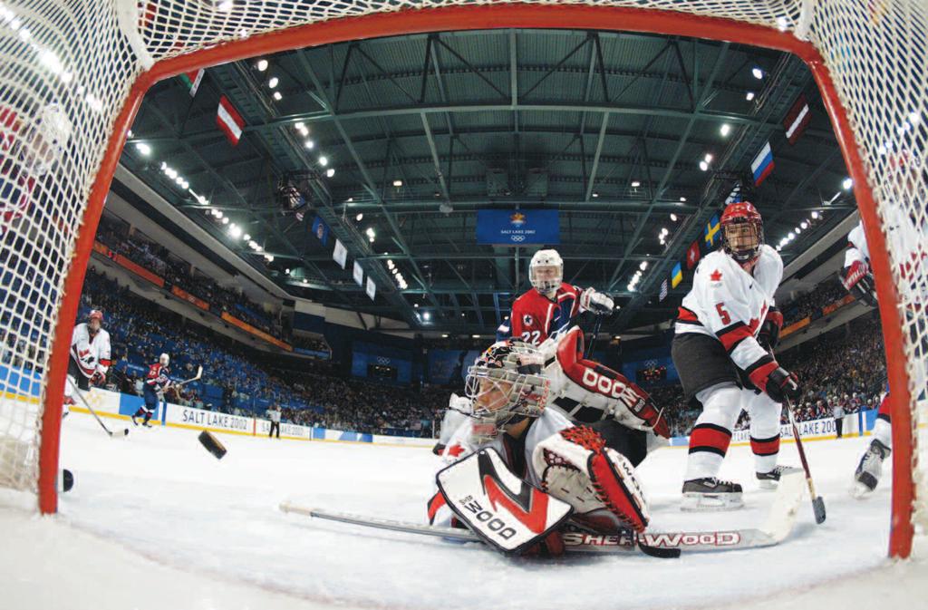 Scoring Slap It In! Canadian goaltender Kim St. Pierre watches as the puck enters the net during the 2002 Winter Olympics. Canada defeated the United States in the women s final to win the gold medal.