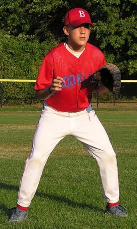 OUTFIELD Fielding Fly Balls READY: Start with feet wider than shoulders, knees bent, waist bent slightly forward, glove extended between chest and waist, weight on balls of feet.