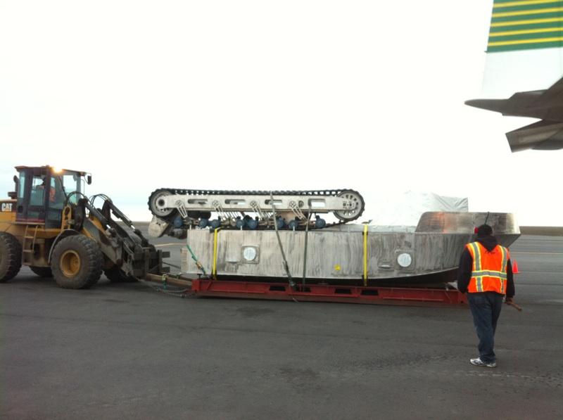 Figure 4. Unloading Tyler Rental s craft at Barrow Airport. The ARKTOS craft used for the demonstration was leased back to ARKTOS Developments, Ltd.