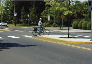 Signage placed at intersections lets bicyclists know how to activate a green light.