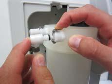 Fill the cartridge with distilled water then empty the contents of a box respectively a syringe of Cleaning solution into the water. a. Stopper b.