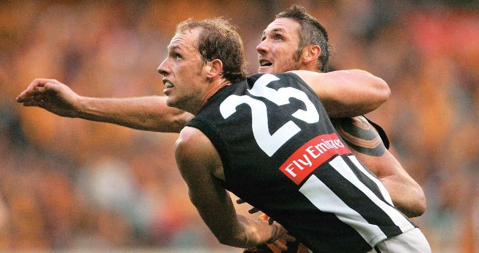 AFL ANNUAL REPORT 2005 the big men duel: The Magpies Josh Fraser (front) and Hawk Peter Everitt both seek the upper hand in one of many ruck duels for the season.