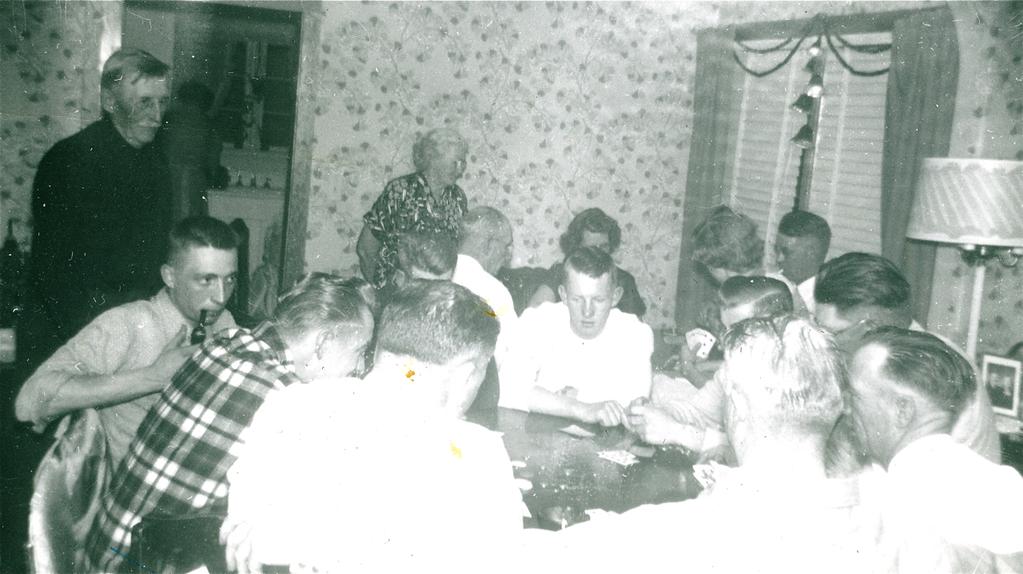 Martin Chester Nelson (Jim) (smoking the pipe) at a Christmas celebration at residence of his uncle and aunt, Floyd Ernest and Bertha T.