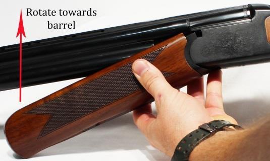 5. Place the forend assembly at a slight angle to the barrel, matching the radius of the forend metal to the radius in the front of the receiver, as in figure 14. Figure 14 6.