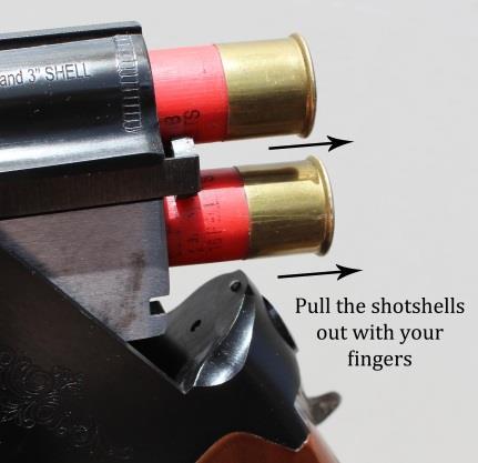 5. Now you can pull each shotshell out with your fingers, as shown in figure 20. Shotgun Disassembly: Figure 20 Warning: Before doing any disassembly, make certain the shotgun is completely unloaded.