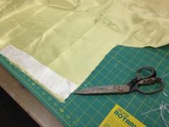 Lay out the cloth on a cutting mat, cut the fiberglass wider than needed and longer than needed by at least 1.