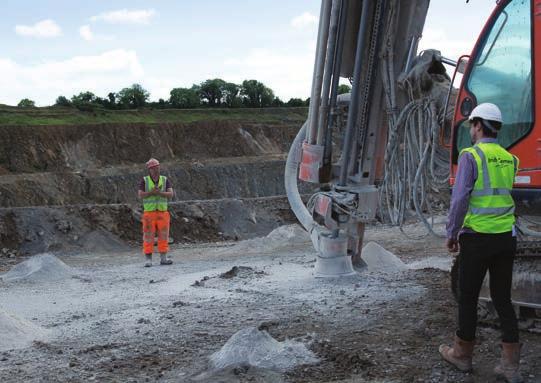 quarried material Quarry Workers marking out drill holes  quarried