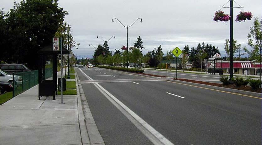 Crossing includes advanced yield lines with signs, marked crosswalk, raised median,