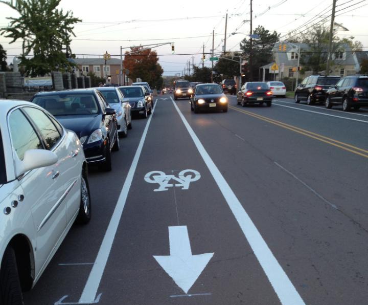 Bike lanes > Requires less space than other options > Requires parking removal or widening > People biking closer to