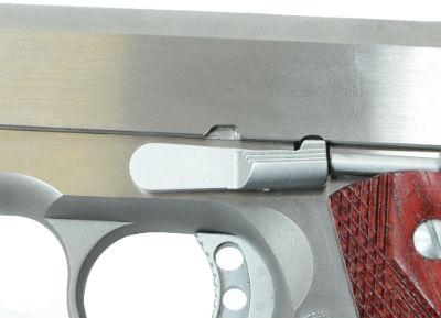 recoil spring plug, and turn the barrel bushing clockwise, towards the right side of