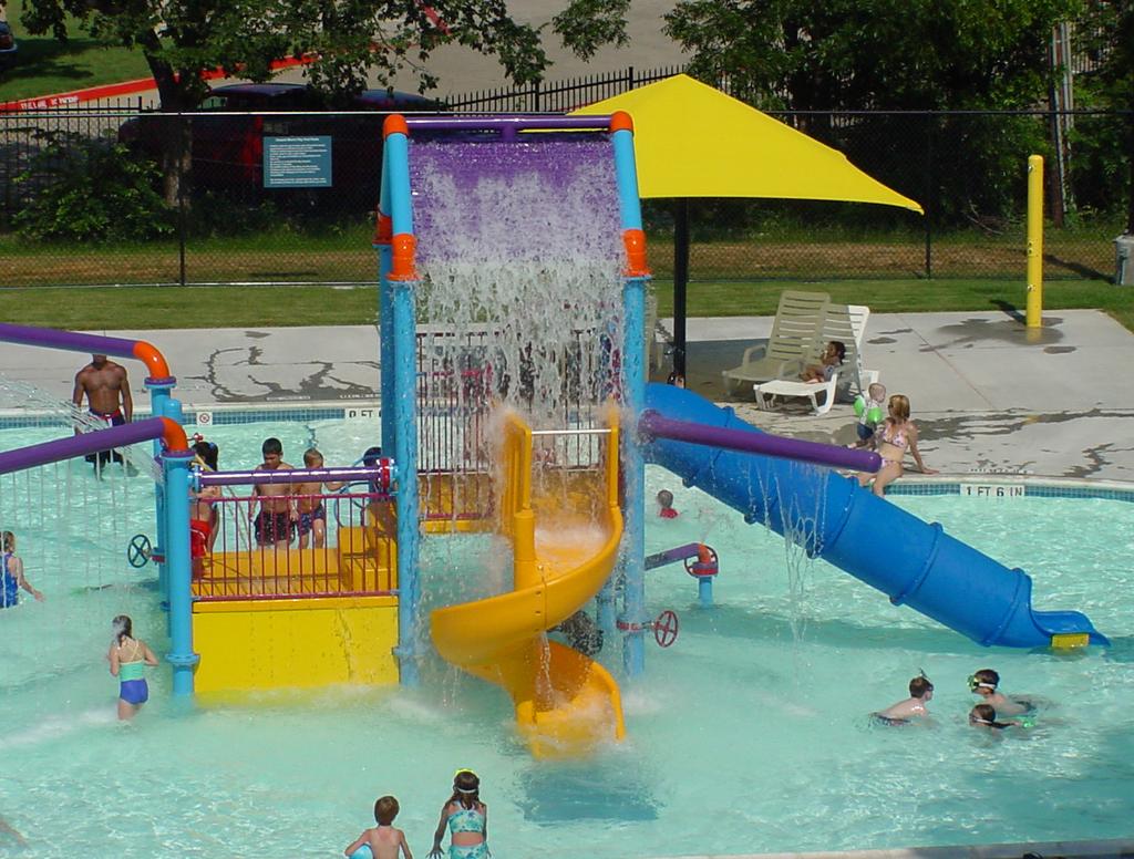 The pool includes an interactive water structure, family changing room, shade structure and small grass area. Limited drink and snack concessions are available.