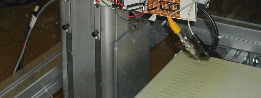 Instead of adding a third linear actuator to the robotic gantry, a Dorner 21 series conveyor belt was built into the floor of the wind tunnel to move the plume source toward the robot.